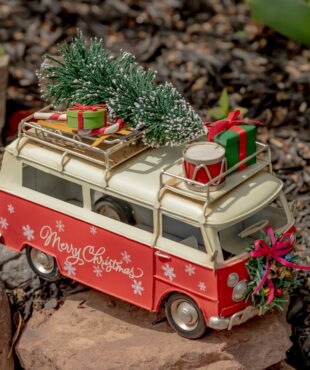 Vintage Style Christmas Bus with a Wreath on the from and Gifts on the Roof