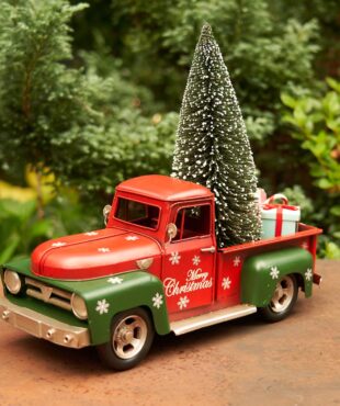 Red and Green Christmas Pick Up Truck with a Christmas Tree and Gifts in the back and it has snow flakes on it as well
