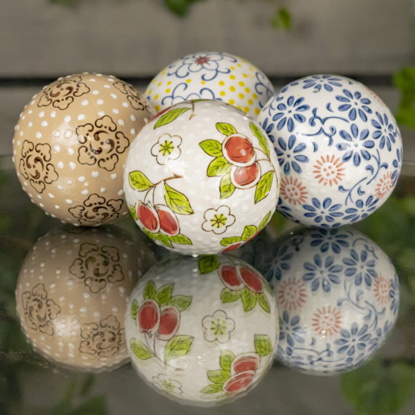 Four Multi Colored Balls with floral Japanese designs