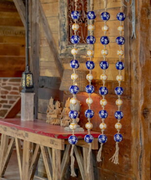 full length image of 4 74 inch long hanging garlands with ceramic sailor balls and rope in blue and orange colors