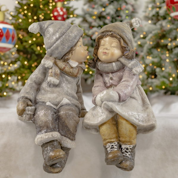 Little Boy Kissing a Little Girl with eyes Closed- In Winter Hats,