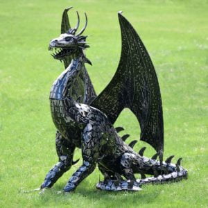 Dragon with Wings Sitting on Grass with Tail Curled