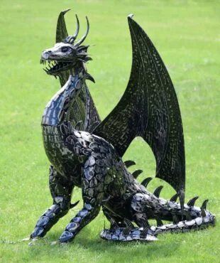 Dragon with Wings Sitting on Grass with Tail Curled