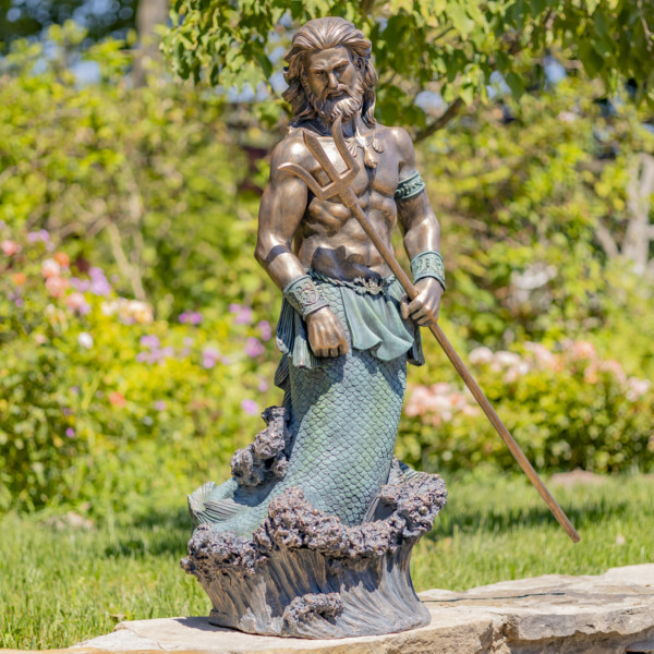 Antique bronze tall merman garden statue with long hair and muscular body holding trident
