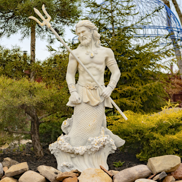 Antique grey tall merman garden statue with long hair and muscular body holding trident