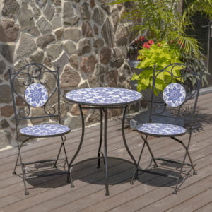 Round Metal Table and Chairs with Blue and White Floral Design throughout