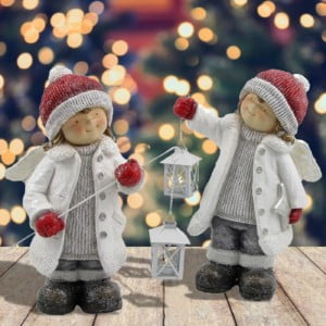 Children with Angel Wings Holding Lanterns with- Christmas Tree with Lighted Background