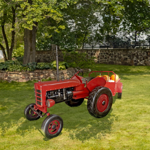 12.5 foot long large red metal tractor with pumpkins in cart in garden