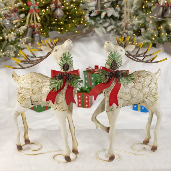 A Pair of Reindeer - Looking Up with Festive Christmas Bows Around their Necks
