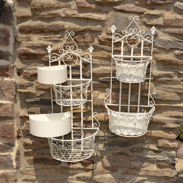 Set of 2 dual half moon-shaped wall hanging planter with removable baskets in antique white distressed finish on a brick wall