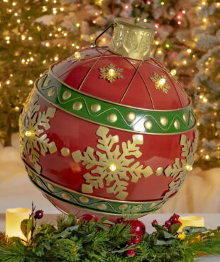 Light-up oversized metal Christmas ornament ball in red with gold snowflakes and LED Lights