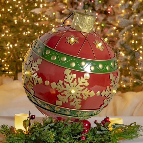 Light-up oversized metal Christmas ornament ball in red with gold snowflakes and LED Lights