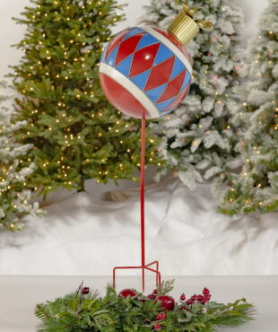 Full View of Large Iron Christmas Ball Sitting on a Stake