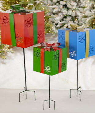 a Trio of Iron Handmade Giftbox Stakes with Bows and Snowflakes