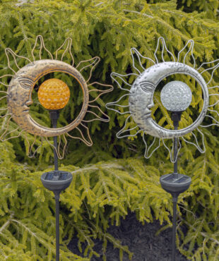 Close up image of solar sun and a moon spinning LED garden stake with round solar ball to the middle that absorbs the light during the day and lets it out in the dark