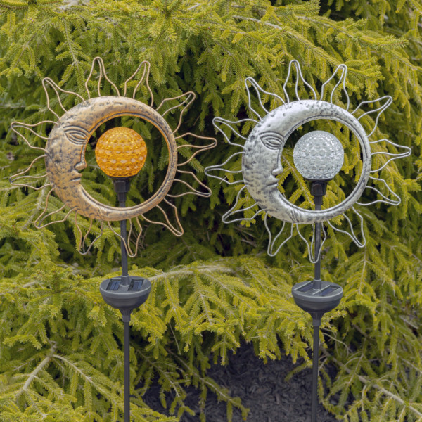 Close up image of solar sun and a moon spinning LED garden stake with round solar ball to the middle that absorbs the light during the day and lets it out in the dark