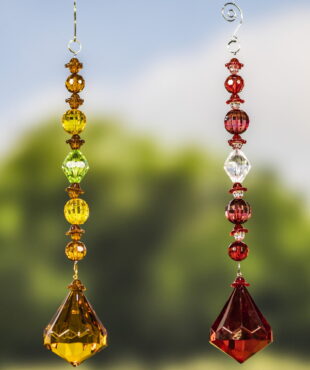 2 hanging acrylic diamond decorations in gold and red colors