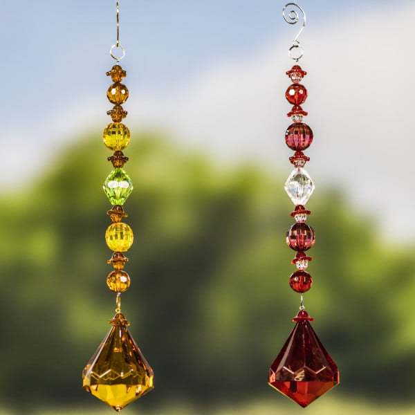 2 hanging acrylic diamond decorations in gold and red colors