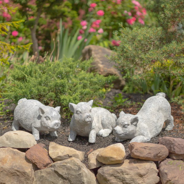 Three Cute Piglet Statues one wit Butt up in the Air