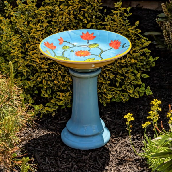 15 tall round porcelain pedestal birdbath in blue with hand painted flowerbuds on a blue basin Odeletta in garden