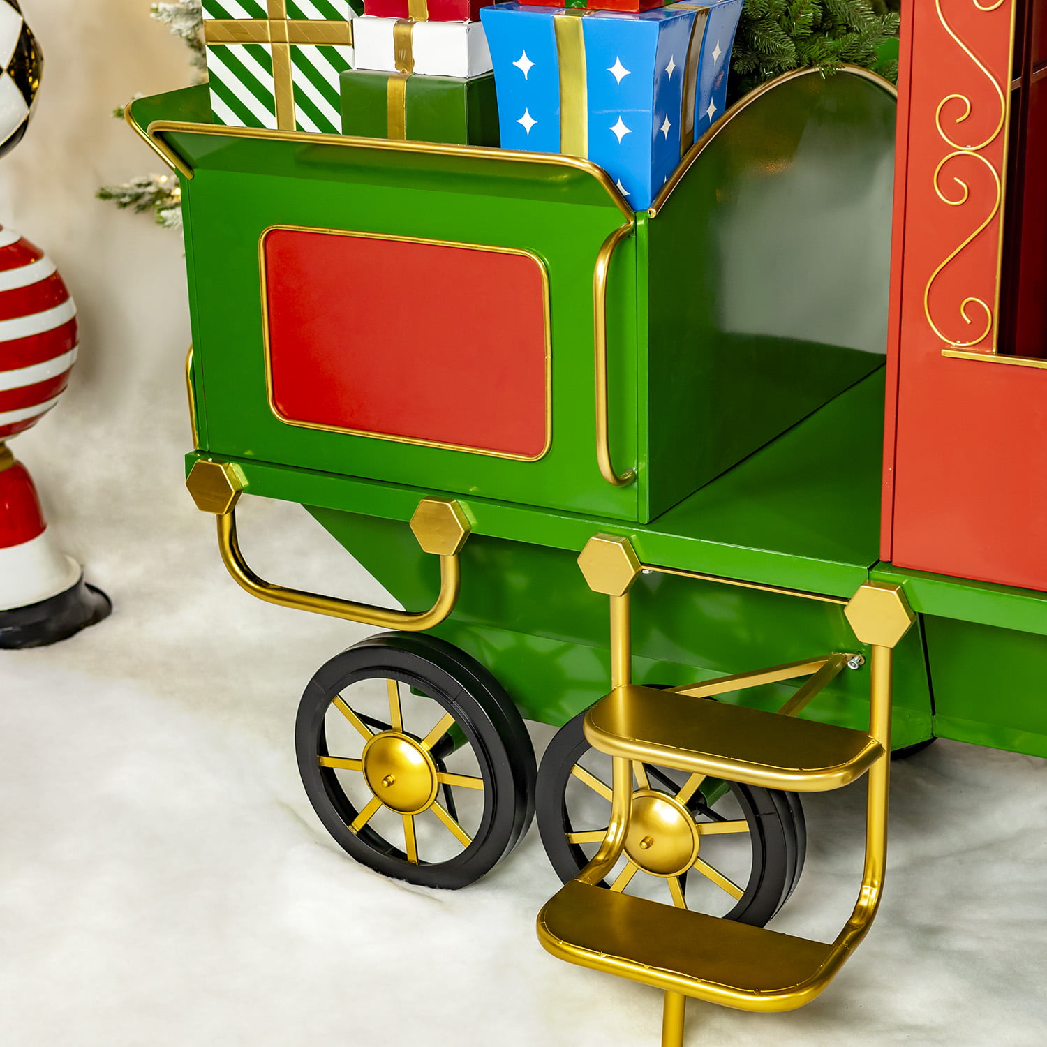 Side view 12.5 feet long large iron Christmas train with cart and lanterns in red, green and gold the north pole express