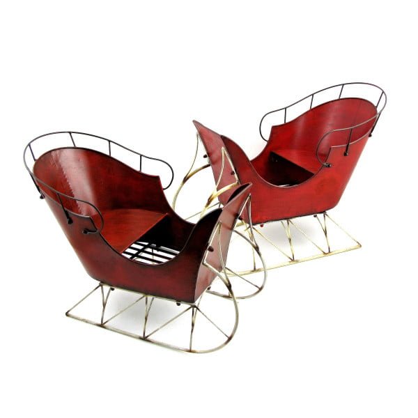 pair of vintage style Christmas sleighs in antique red finish on white background
