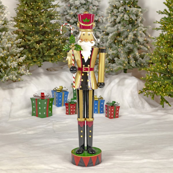 5.5 Feet tall Freestanding iron nutcracker soldier in gold with candy cane and LED Lights