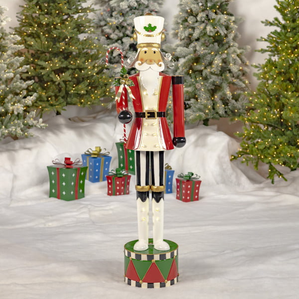 65 inch tall freestanding iron Nutcracker soldier in red with candy cane and LED Lights
