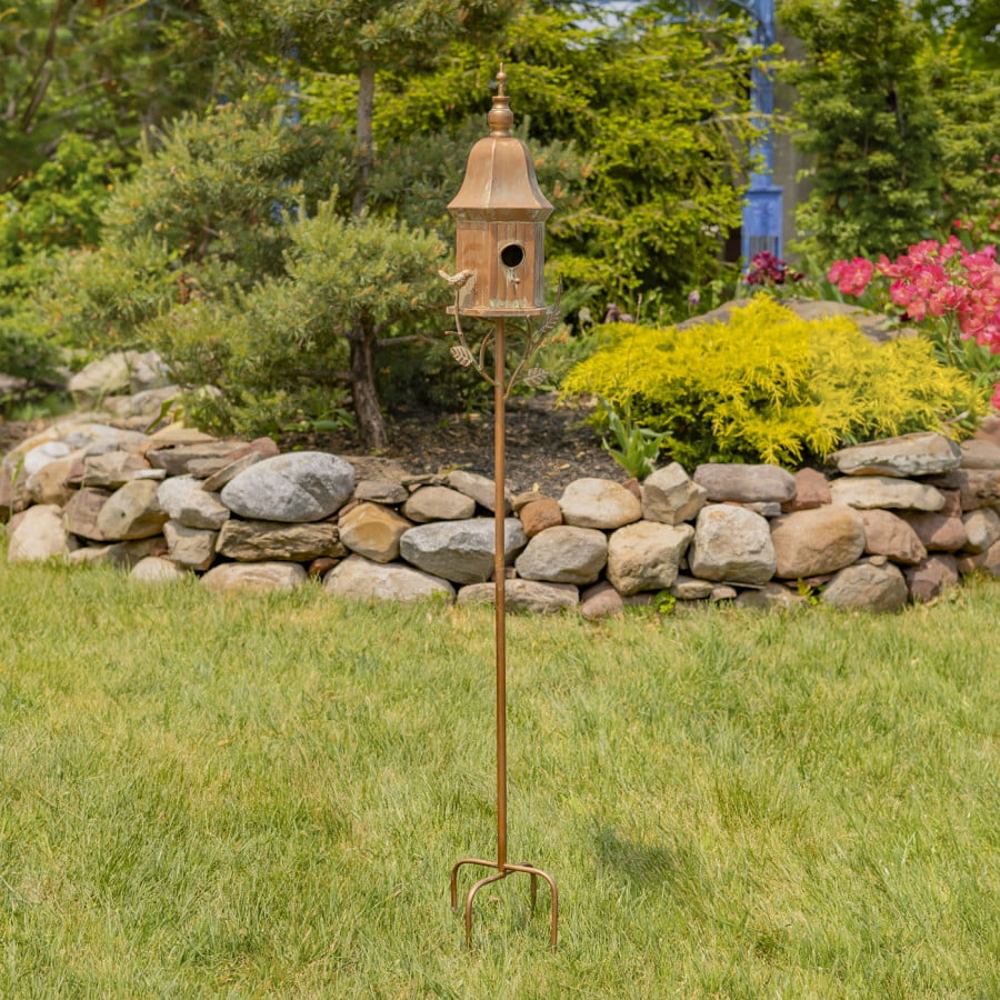 full size image of iron bell roof birdhouse in antique copper hand-painted distressed finish with patina details standing on a 4 prong iron stake decorated with leaves and little bird perched on a leaf