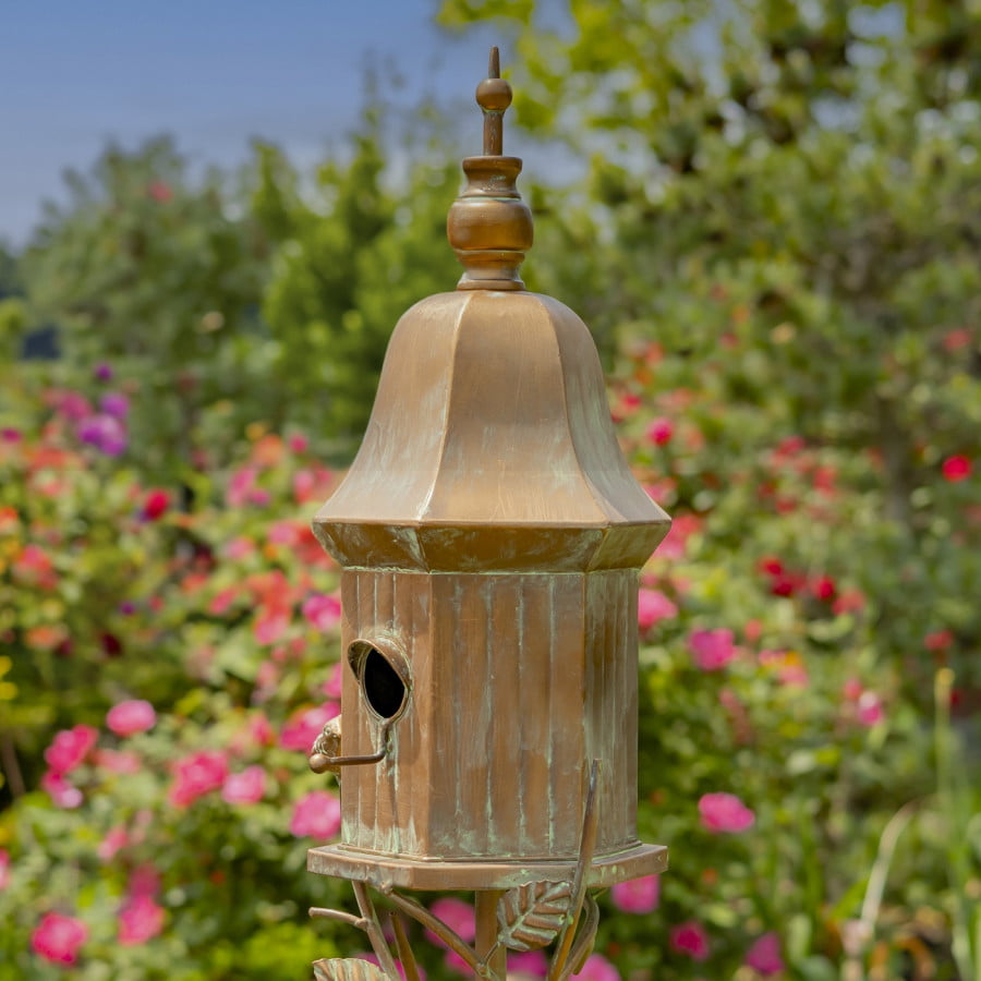 side view image of iron birdhouse stake in antique copper hand-painted distressed finish with patina details with bell roof and little bird perched on decorative leaf