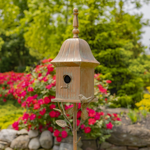 side view image of iron birdhouse stake in antique copper hand-painted distressed finish with patina details with bell roof and little bird perched on decorative leaf