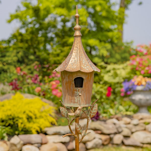 front view of iron birdhouse stake in antique copper hand-painted distressed finish with patina details with cone roof and little bird perched on decorative leaf