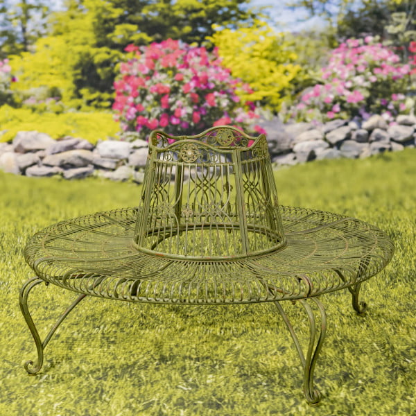 Victorian style round metal tree bench in distressed green-brown finish in garden