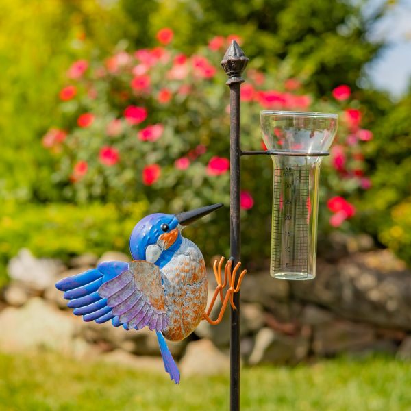 closed up image garden stake with hummingbird and glass rain gauge