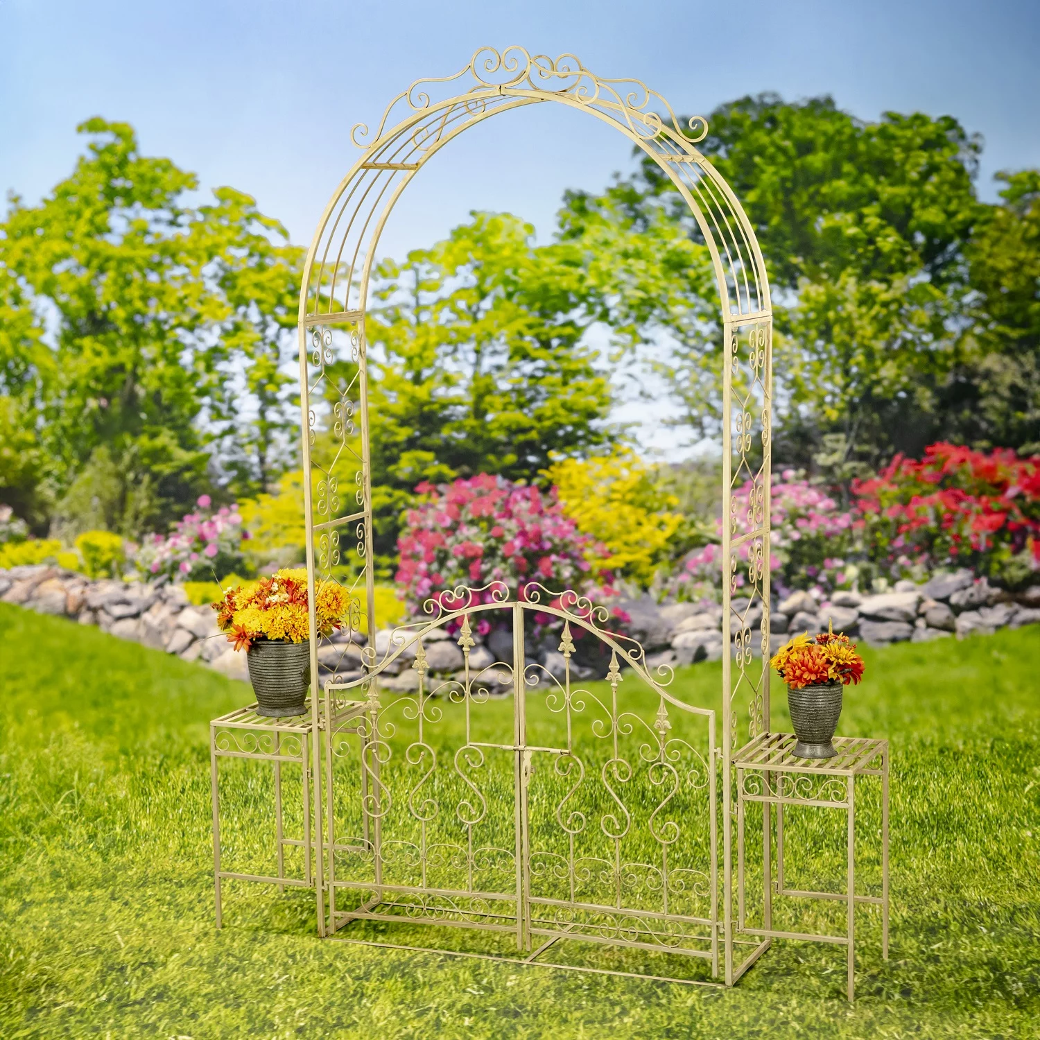 Iron Garden gate archway with 2 side Plant Stands with flowers on them in distressed antique white finish in garden