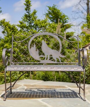 classic iron garden bench with ornate round top with engraved howling wolf and moon in distressed antique bronze finish