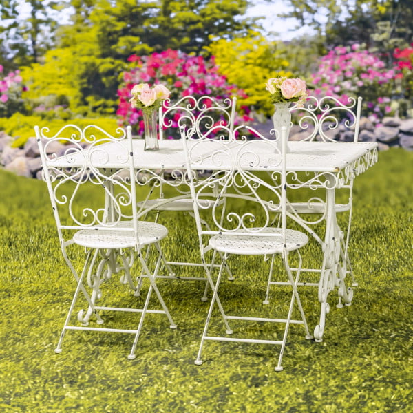 Metal dining set for 4 people consists of 4 chairs and 1 rectangular table in destressed antique white finish decorated with 2 clear vases with flowers