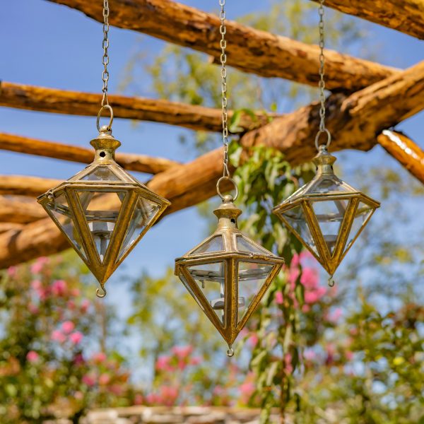 3 hanging iron diamond-shaped lanterns in frosted gold finish with tea-light candleholder