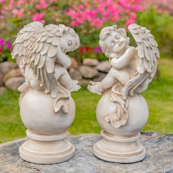 pair of 2 cherubs sitting on globe in antique white finsih