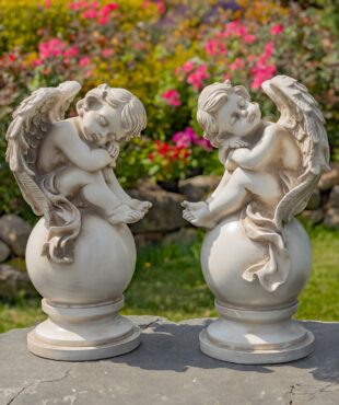Set of Two 21 Tall Magnesium Cherubs Sitting on Globe Pedestals Yael & Cael