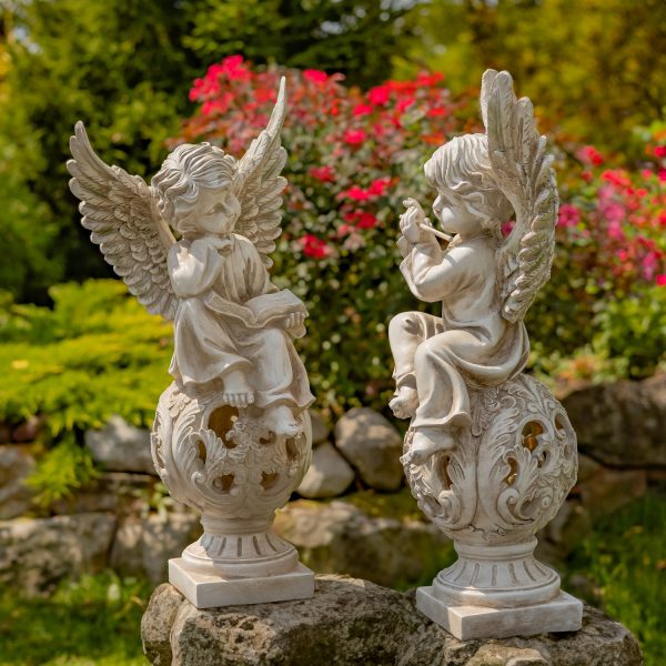 pair of 2 25 inch tall cherubs reading and playing the glute on ornate pedestal in antique white finish