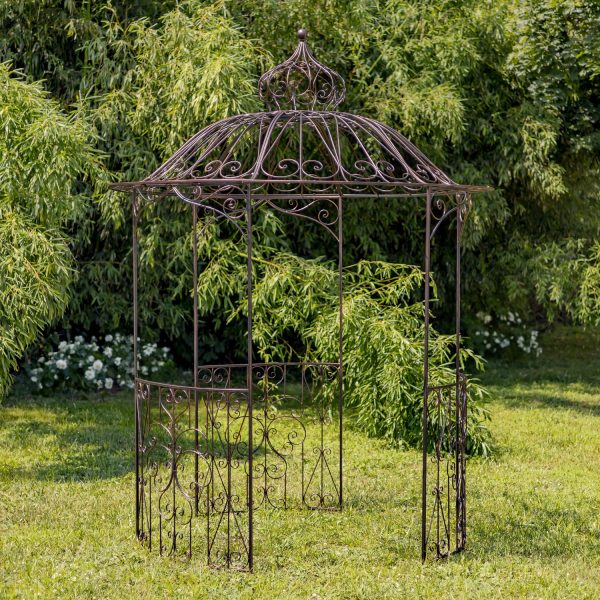 10 feet tall iron round gazebo with round walls and dome in antique bronze distressed finish standing in garden