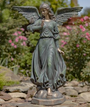 image of 46 inch tall angel statue with open wings in billowing dress and bird perched on her shoulder, painted in antique bronze finish, standing in garden