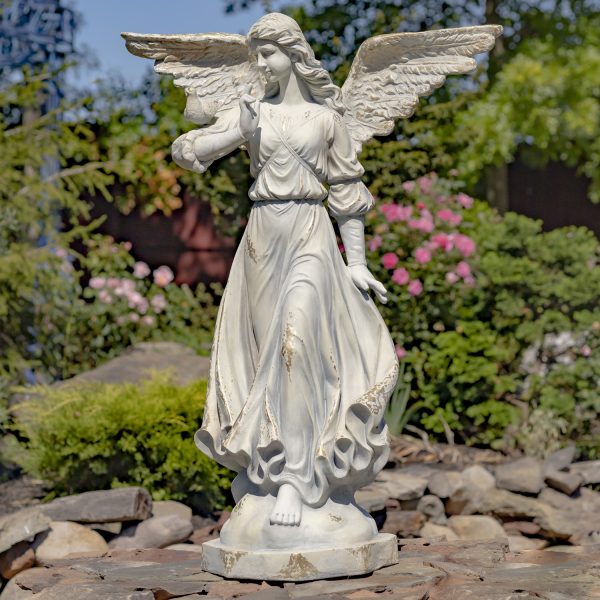 image of 46 inch tall angel statue with open wings in billowing dress and bird perched on her shoulder, painted in antique grey finish, standing in garden