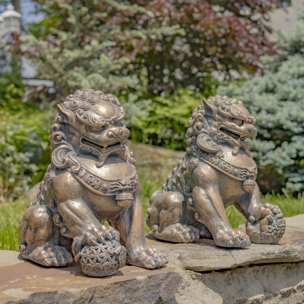 set of 2 16 inch tall Fu Dog Sentry Statues in antique bronze finish standing in garden