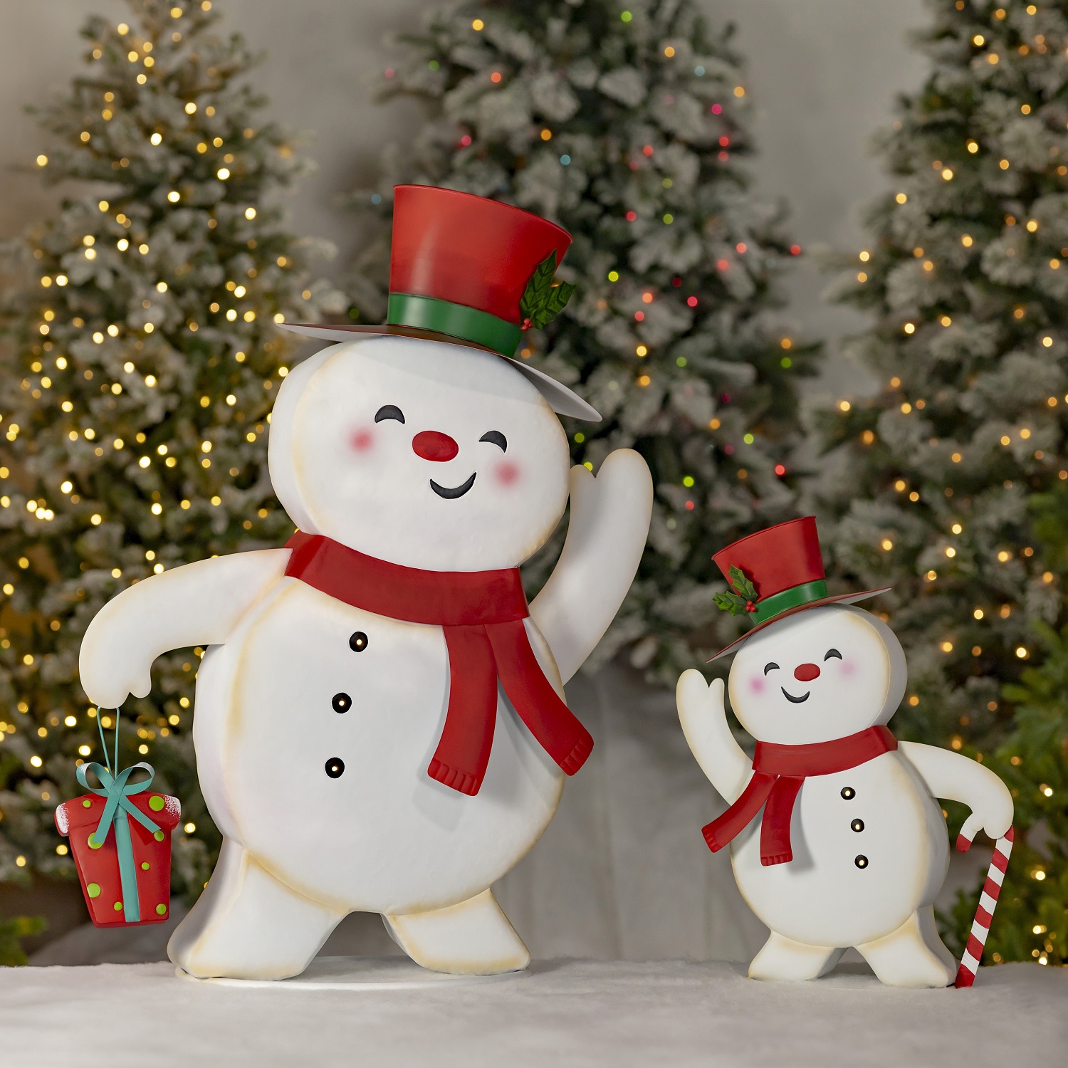 set of two, small and large, friendly snowmen metal figurines in top hats and scarves