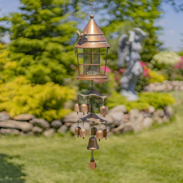 43 inch long iron birdfeeder in lantern shape with toadstool and bell accents attached underneath it in antique copper finish