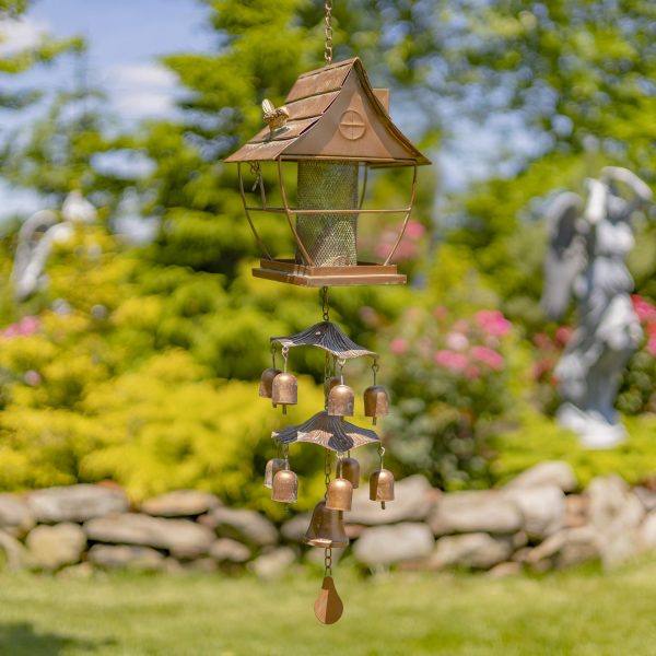 37 inch long iron birdfeeder in pagoda shape with toadstool and bell accents attached underneath it in antique copper finish