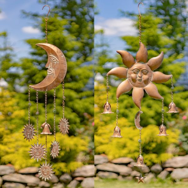 collage image of 2 iron wind chimes in sun and moon shape with dangling bells, painted in antique copper finish, hanging in garden