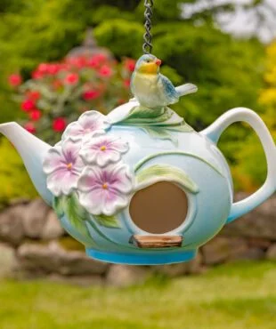 Crafted with exceptional quality, these unique birdhouses showcase intricate hand-painted designs and beautifully textured porcelain